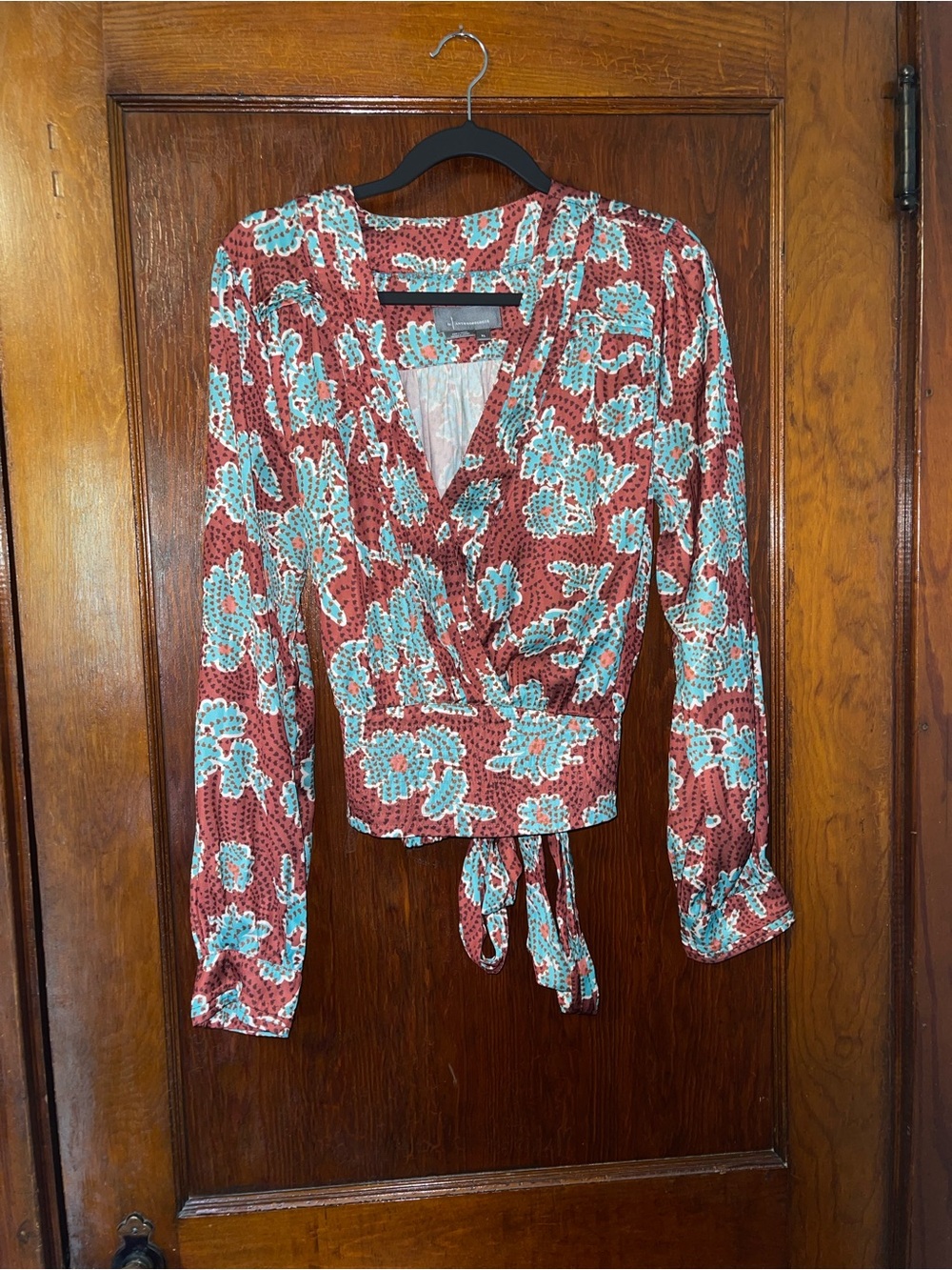 Anthropologie Rust Red Floral Wrap Top with Teal Accents